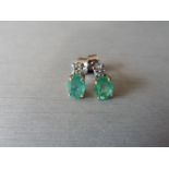 Emerald and Diamond drop earrings. Each set with a 7 x 5mm oval cut emerald ( treated), 1.60ct