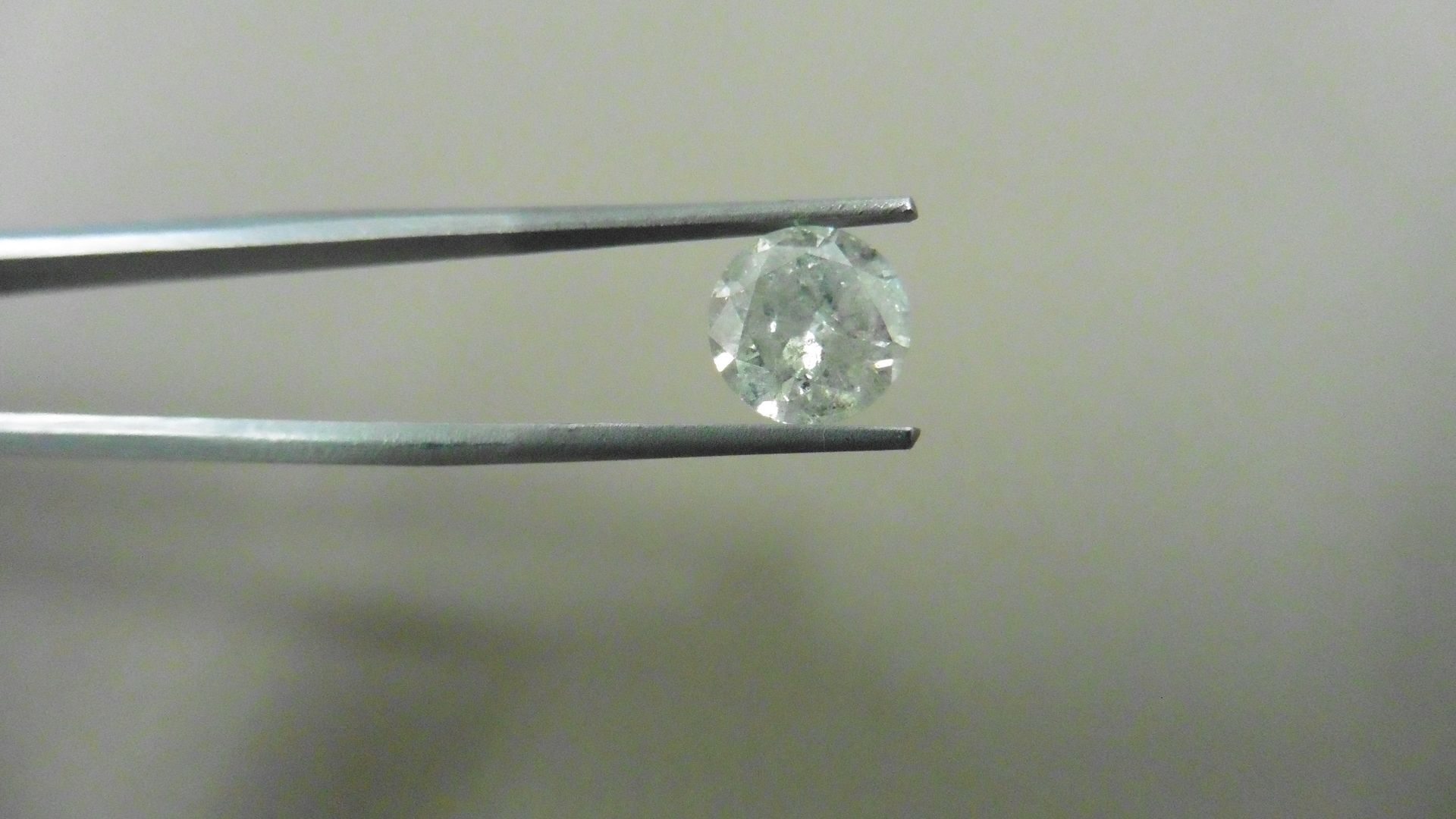 2.04ct Brilliant Cut Diamond, Enhanced stone. I colour, I2 clarity. 7.80 x 4.96mm. Valued at £