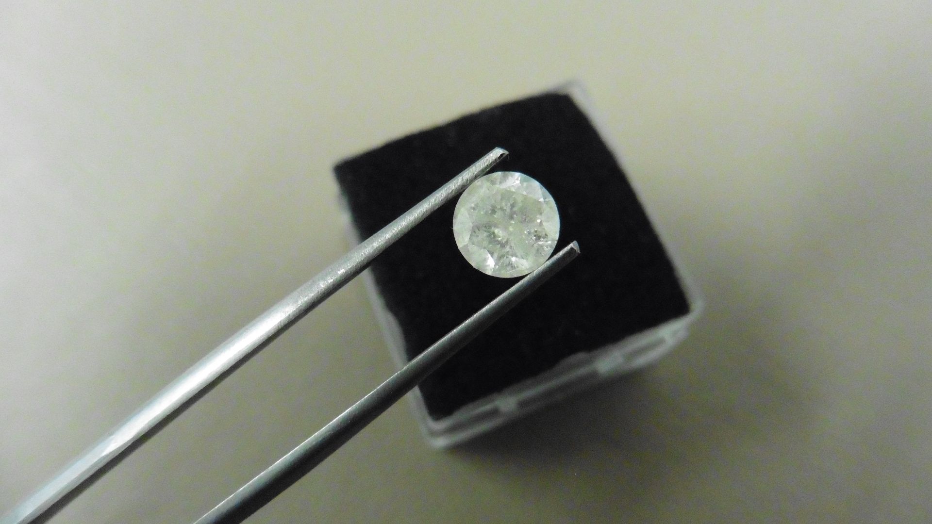 1.04ct Brilliant Cut Diamond, Enhanced stone. I colour, I2 clarity. 6.49 x 3.85mm. Valued at £