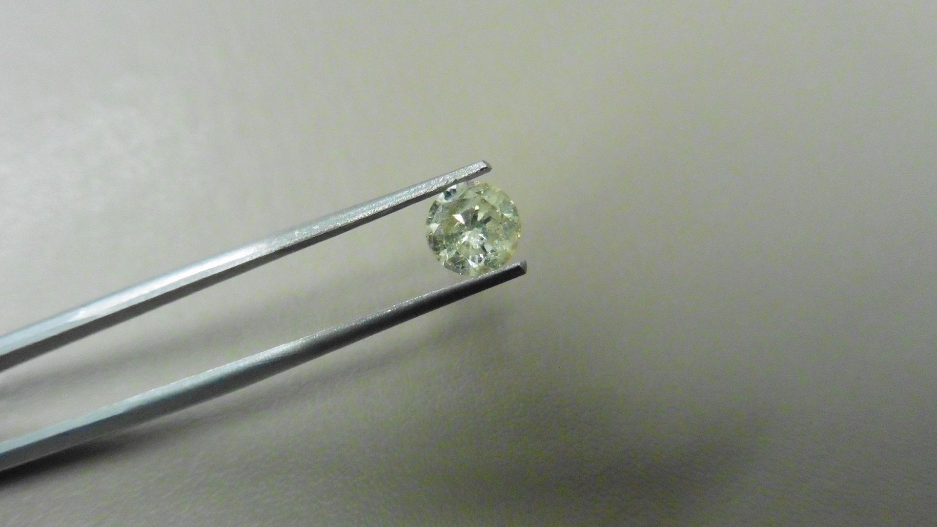 1.03ct Brilliant Cut Diamond, Enhanced stone. J colour, i2 clarity. 6.30 x 3.86mm. Valued at £