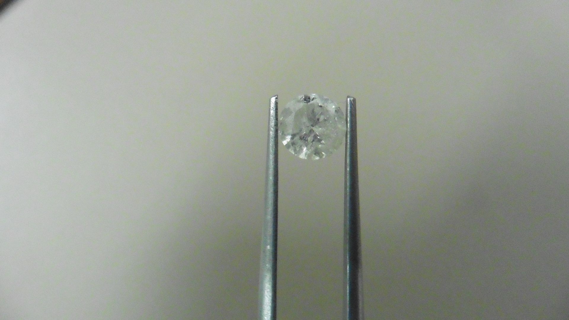 1.02ct Brilliant Cut Diamond, Enhanced stone. H colour, I2 clarity. 6.27 x 4mm. Valued at £1490.