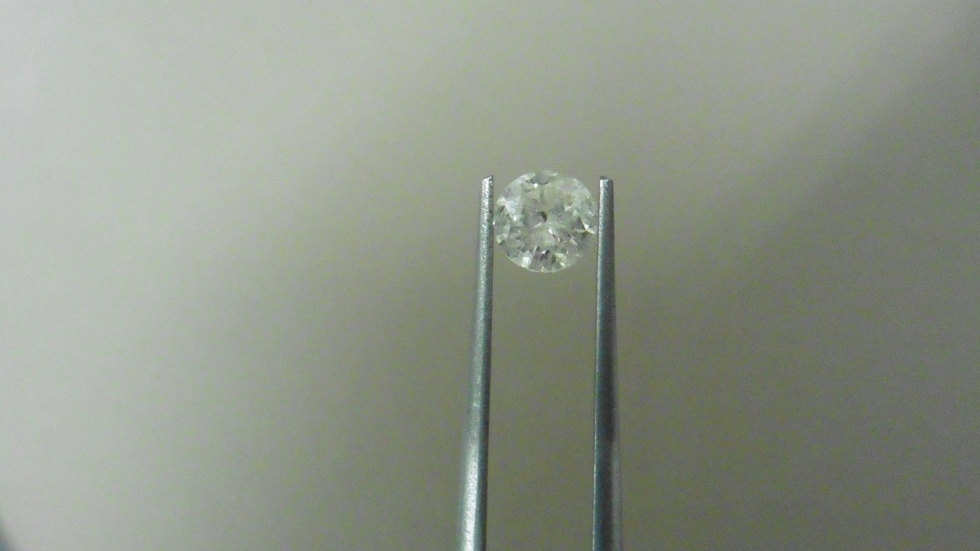1.02ct Brilliant Cut Diamond, Enhanced stone. I colour, I2 clarity. 6.34 x 3.93mm. Valued at £