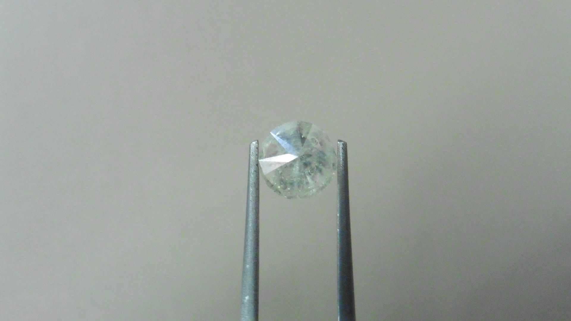 1.34ct Brilliant Cut Diamond, Enhanced stone. I colour, I2 clarity. 6.92 x 4.29mm. Valued at £
