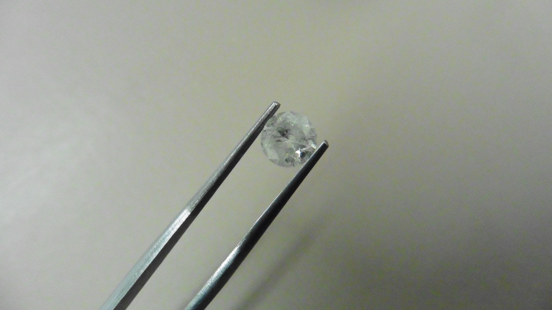 1.01ct Brilliant Cut Diamond, Enhanced stone. H colour, I2 clarity. 6.44 x 3.79mm. Valued at £