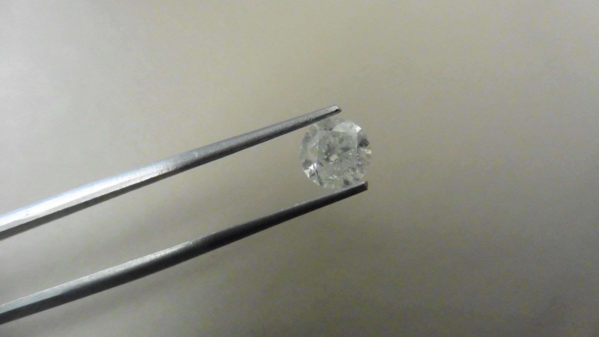 1.41ct Brilliant Cut Diamond, Enhanced stone. H colour, I2 clarity. 6.69 x 4.77mm. Valued at £