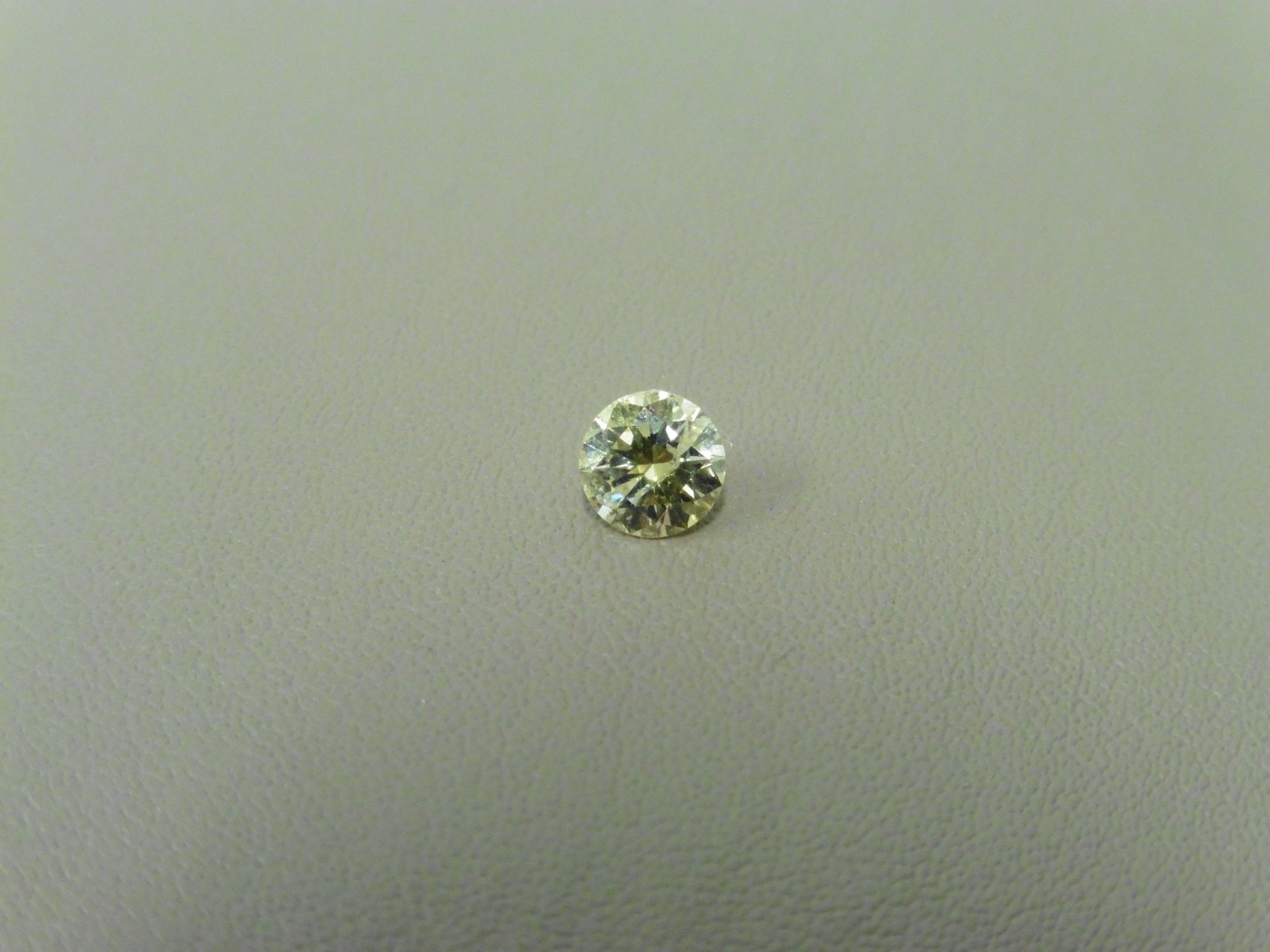 0.51ct brilliant cut diamond. Fancy yellow colour, SI2 clarity. AGI Certificate Ð 975781. Valued