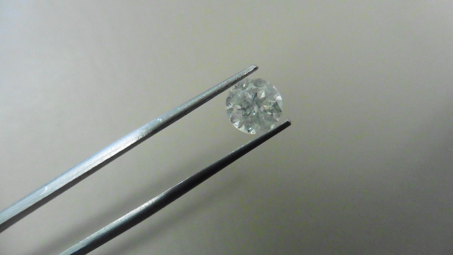 1.66ct Brilliant Cut Diamond, Enhanced stone. H colour, P1-2 clarity. 7.23 x 4.88mm. Valued at £