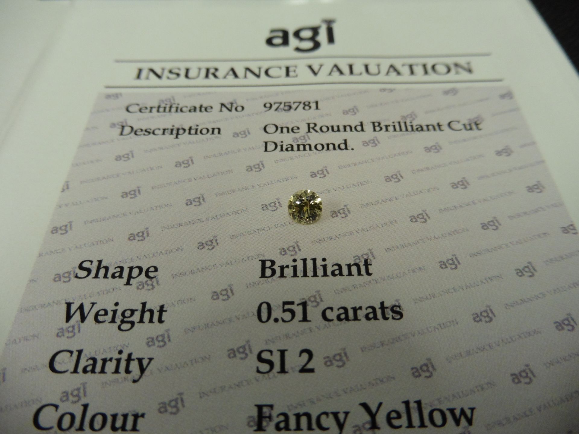 0.51ct brilliant cut diamond. Fancy yellow colour, SI2 clarity. AGI Certificate Ð 975781. Valued - Image 3 of 4