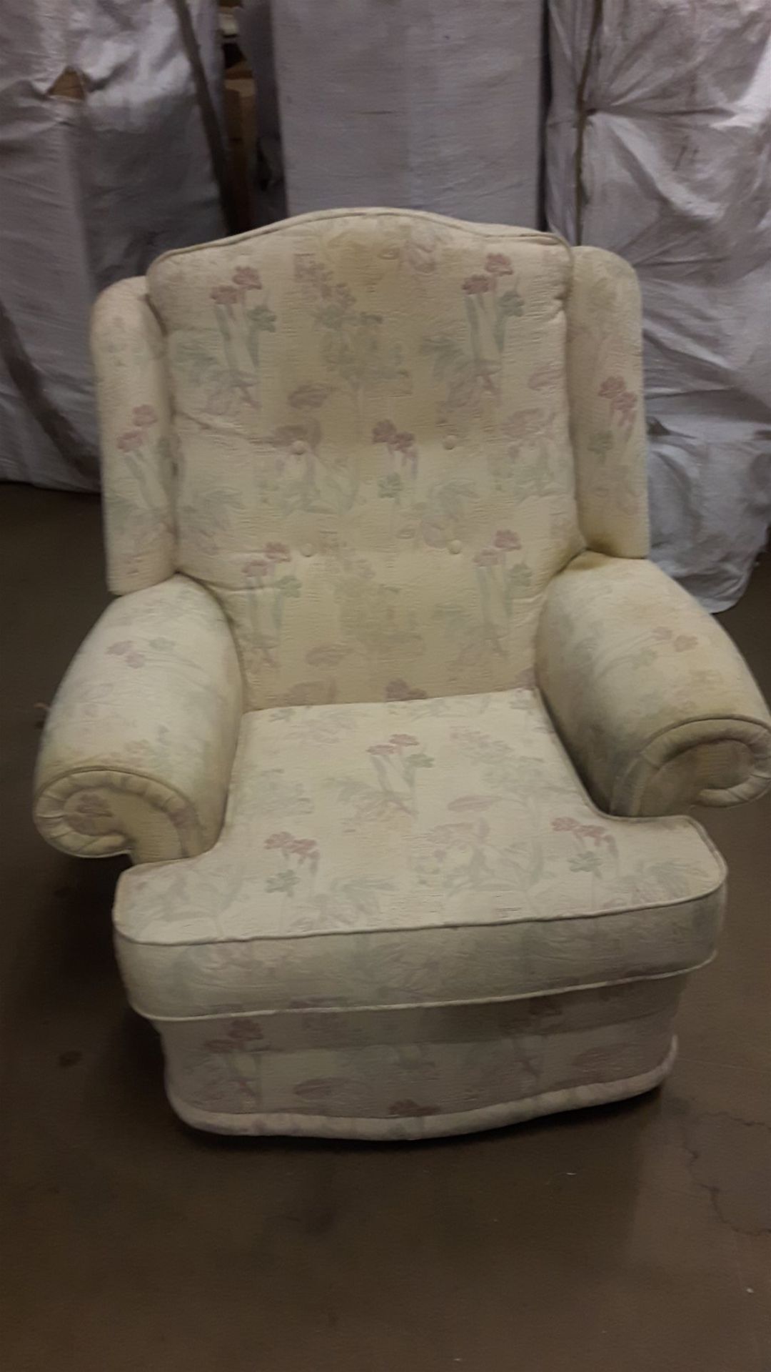 Single armchair in a cream and floral design.