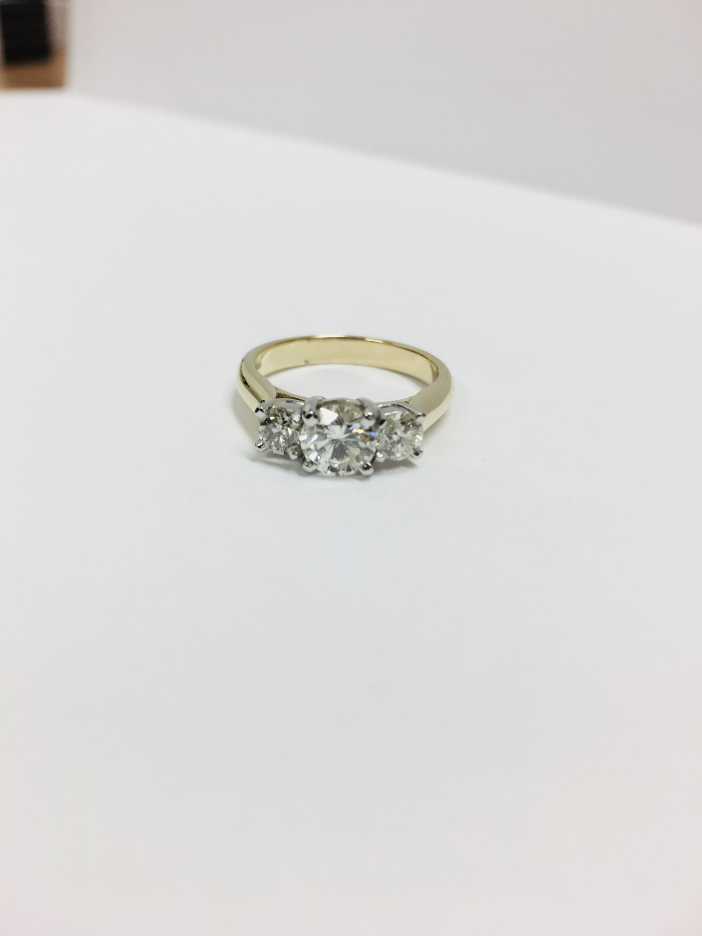 18ct yellow/white gold 1.30ct three stone diamond ring,0.70ct centre iamond h i1 clarit,2x0.30ct(0.