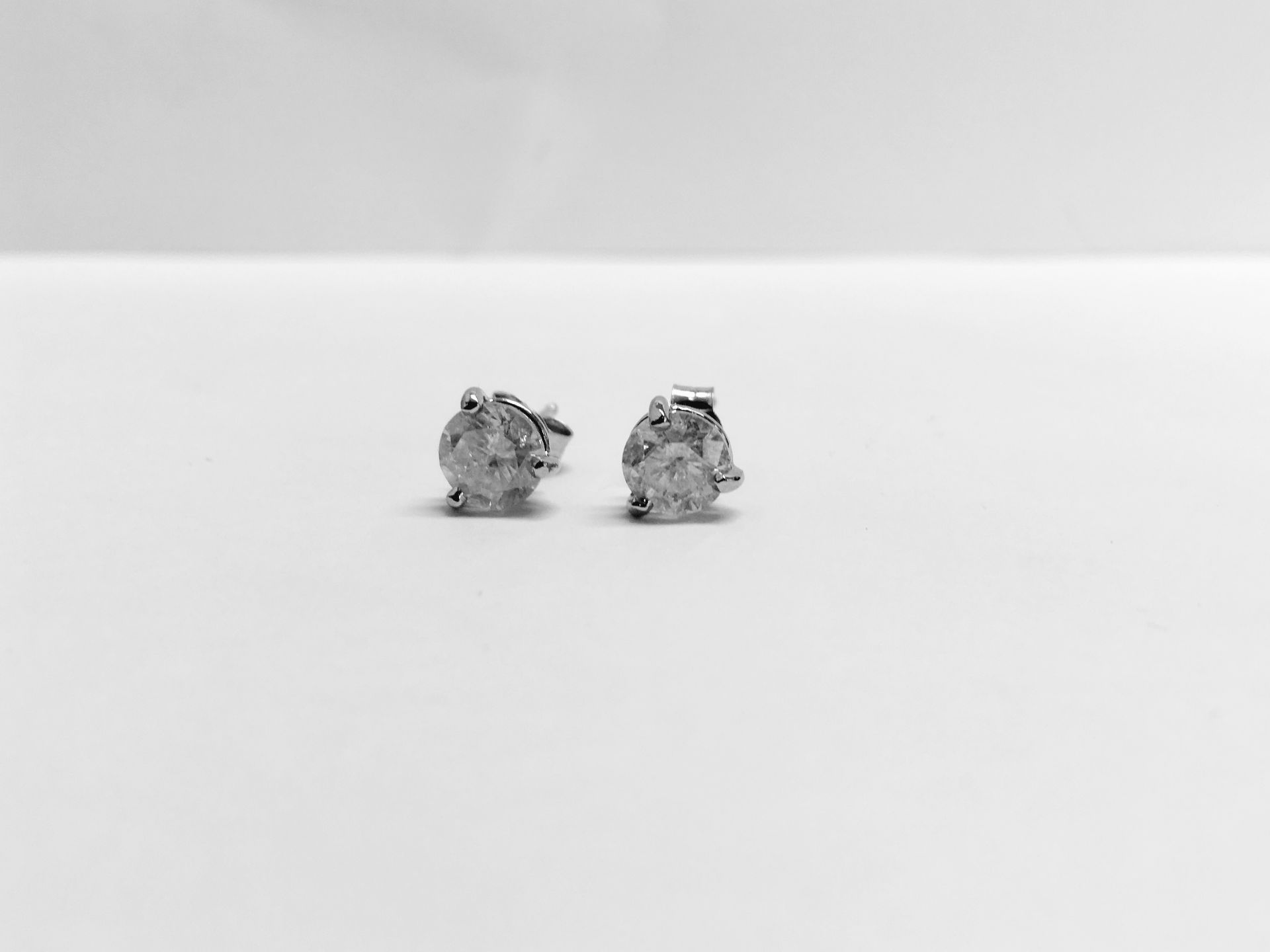 2.00ct Solitaire diamond stud earrings set with brilliant cut diamonds which have been enhanced. I - Image 4 of 4