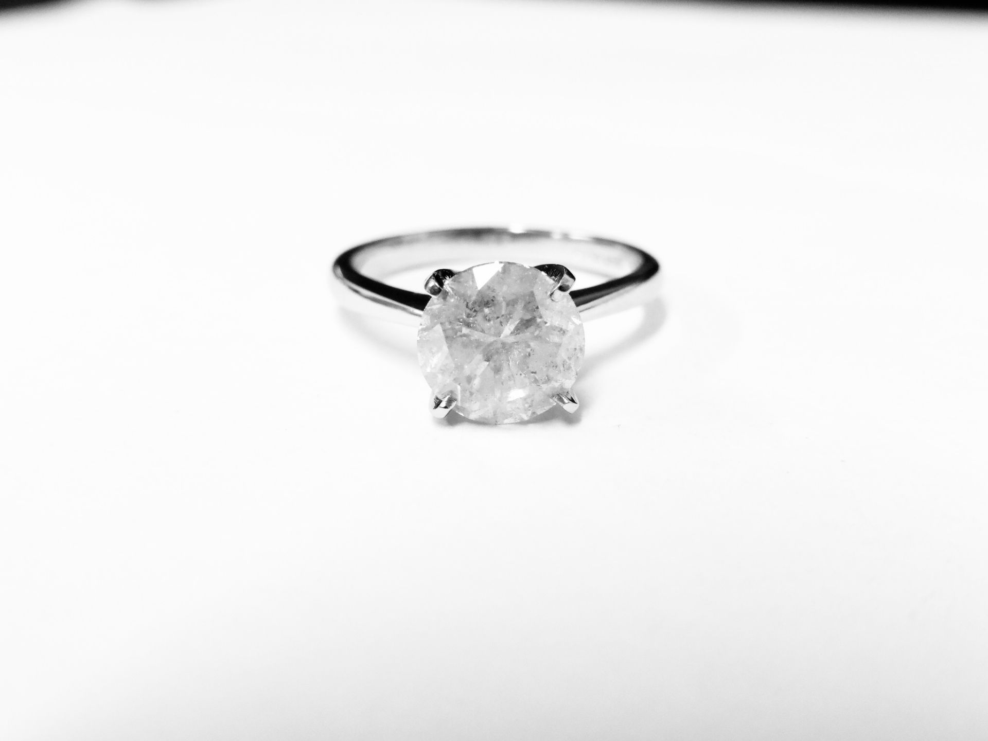 2.00ct diamond solitaire ring set in 18ct gold. Enchanced diamond, H colour and I2 clarity. 4 claw