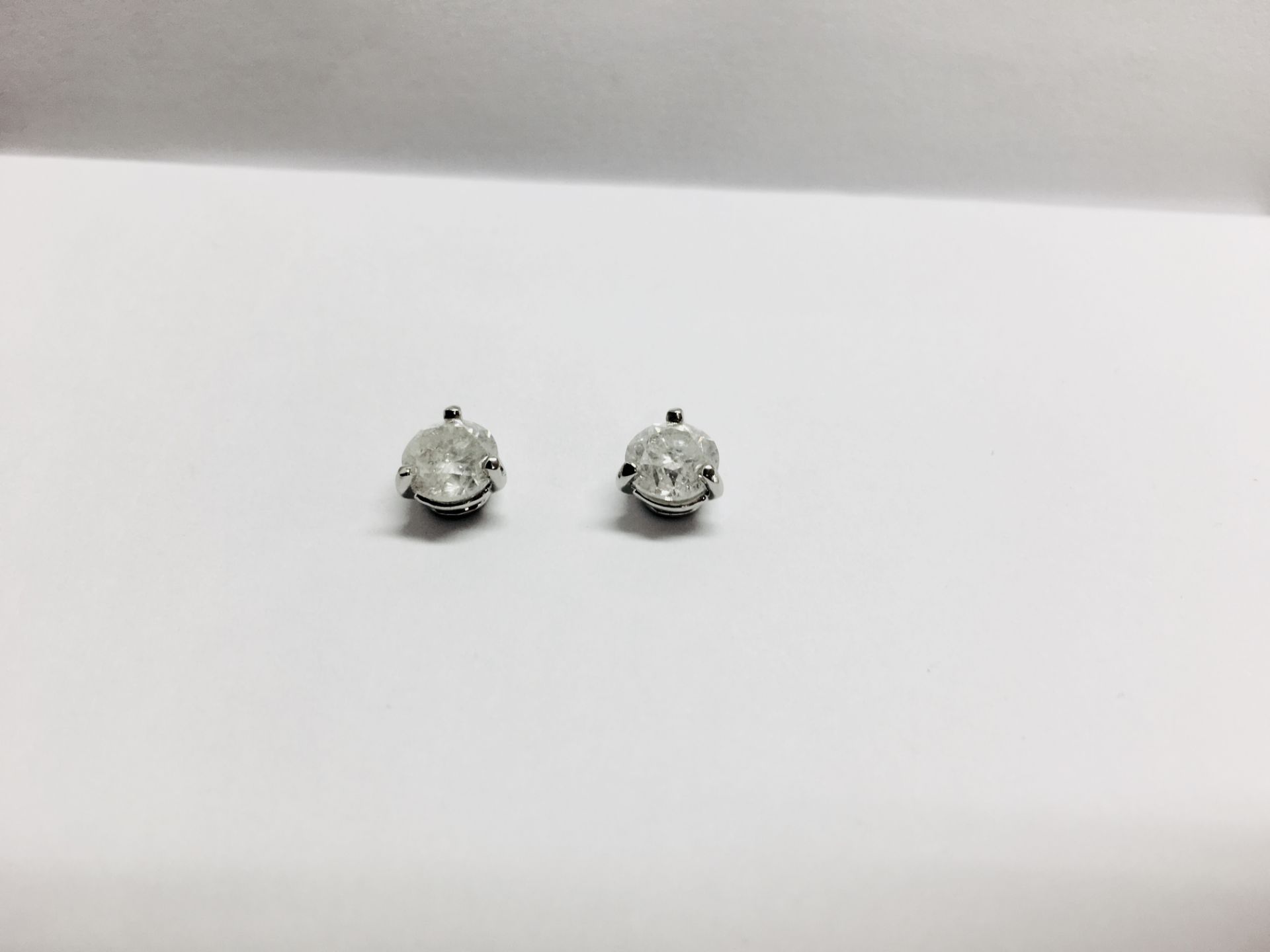 2.00ct Solitaire diamond stud earrings set with brilliant cut diamonds which have been enhanced. H/I - Image 3 of 3