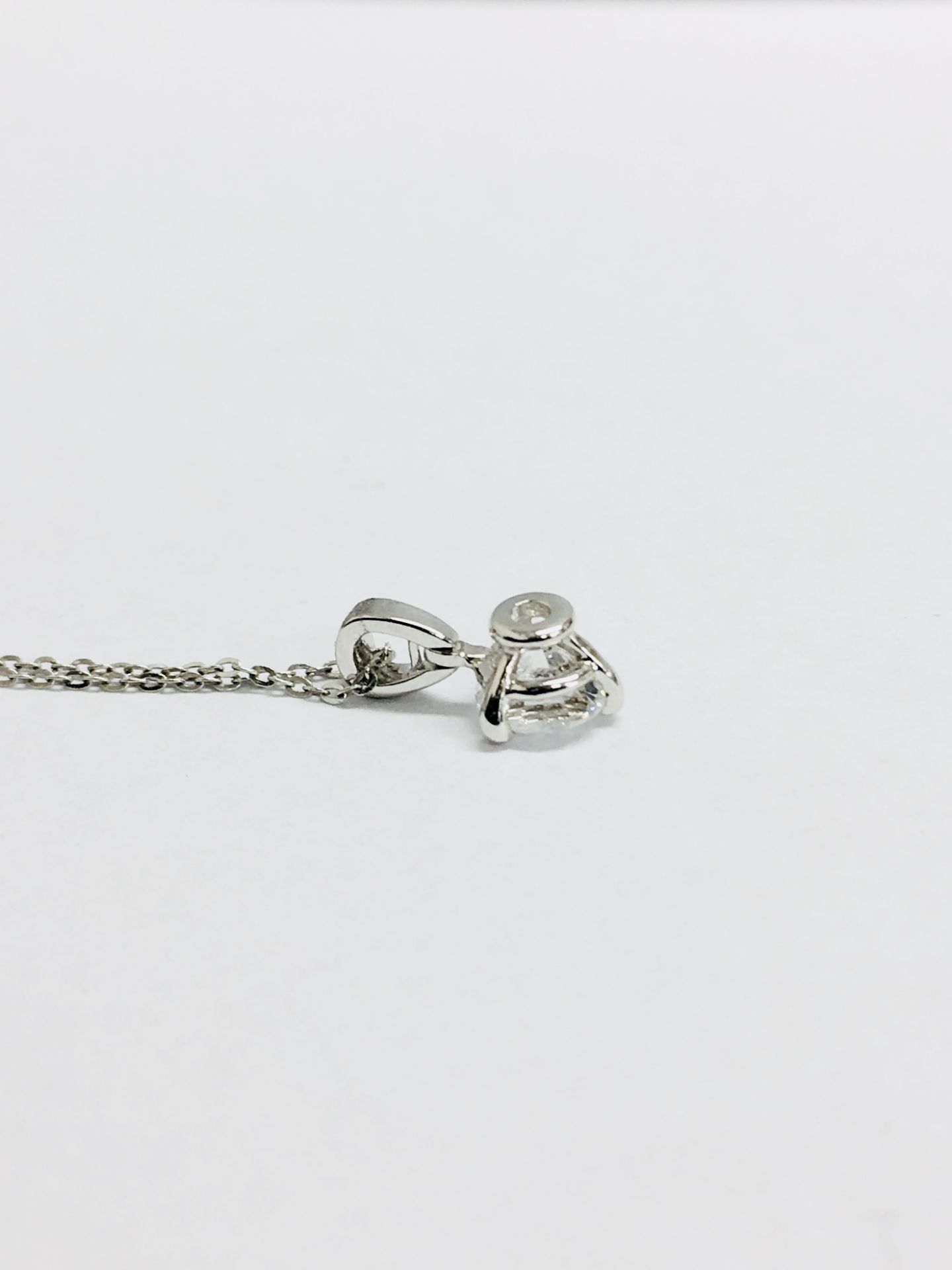 Platinum diamond pendant 0.50ct,0.50ct h colour vs grade(enhanced) platinum 1.5gms ,18ct white - Image 2 of 4