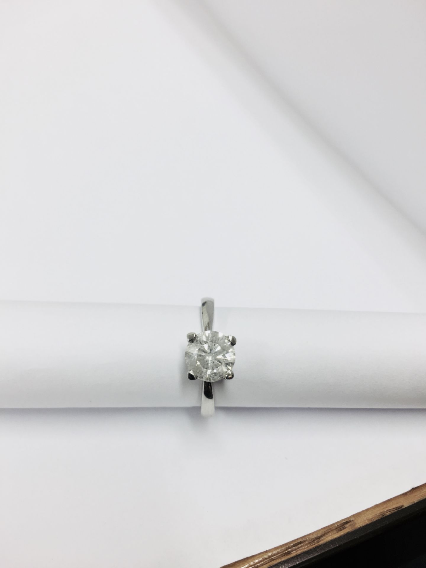 1.55ct diamond solitaire ring set in platinum. Enchanced diamond, H colour and I2 clarity. 4 claw