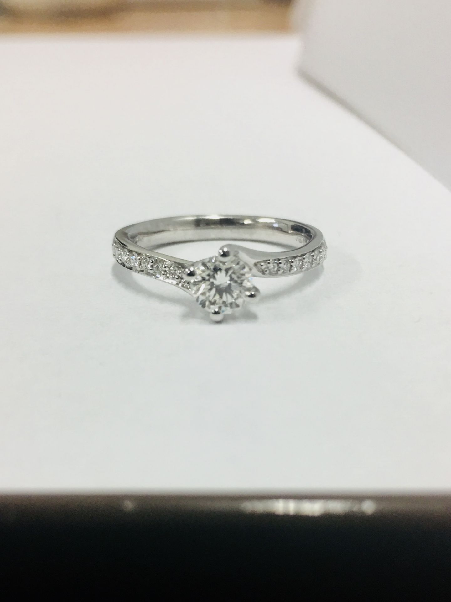 18ct diamond solitaire 0.50ct h colour vs grade enhanced ,0.14ct diamonds set into the mount 2.