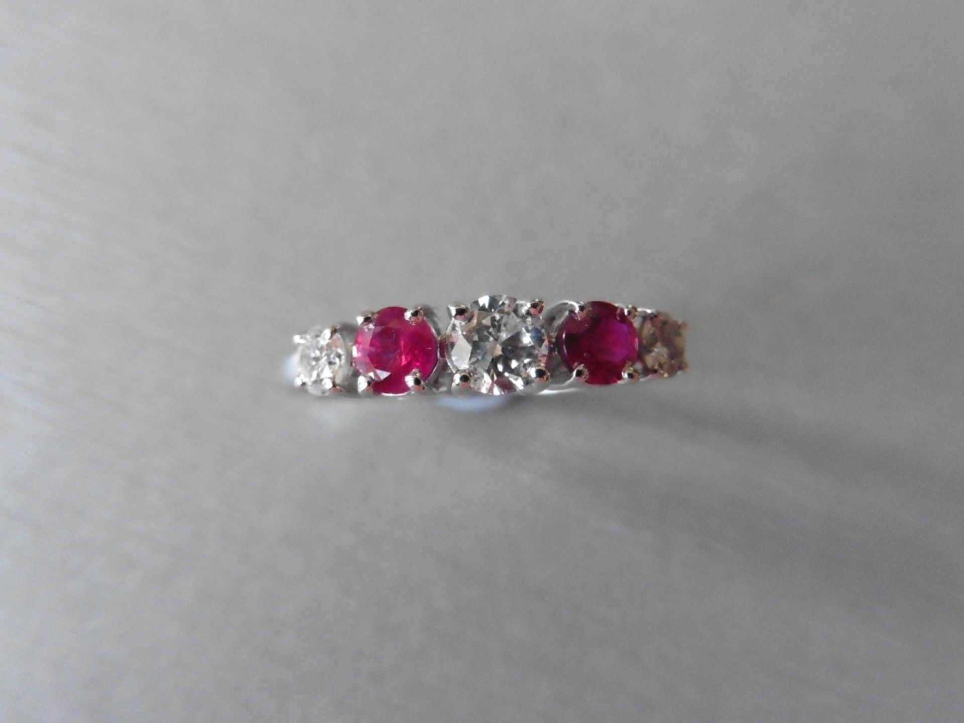 0.75ct ruby and diamond five stone ringset in 18ct gold. 2 rubies( treated ) 3 brilliant cut - Image 2 of 3