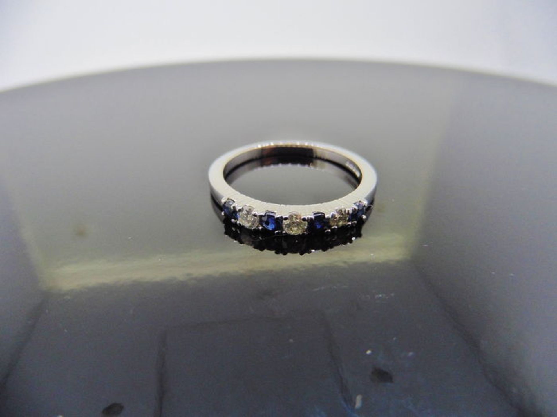 0.40ct sapphire and diamond eternity style ring. Set with 4 round cut sapphires and 3 diamonds. Size - Image 3 of 3