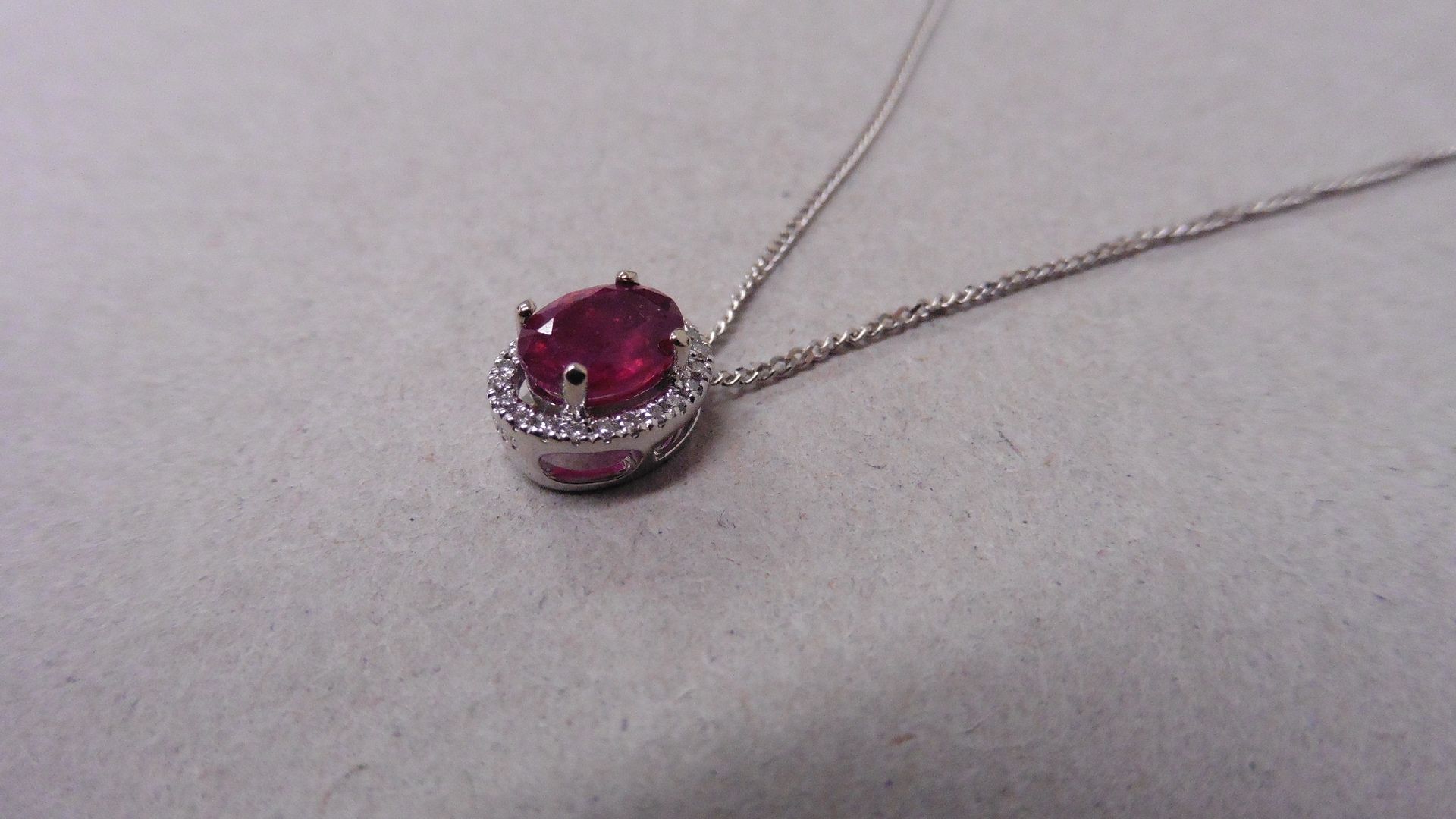 2.40ct halo set diamond pendant. Oval cut ruby ( glass filled ) in the centre, 2.40ct, with a halo - Image 2 of 4