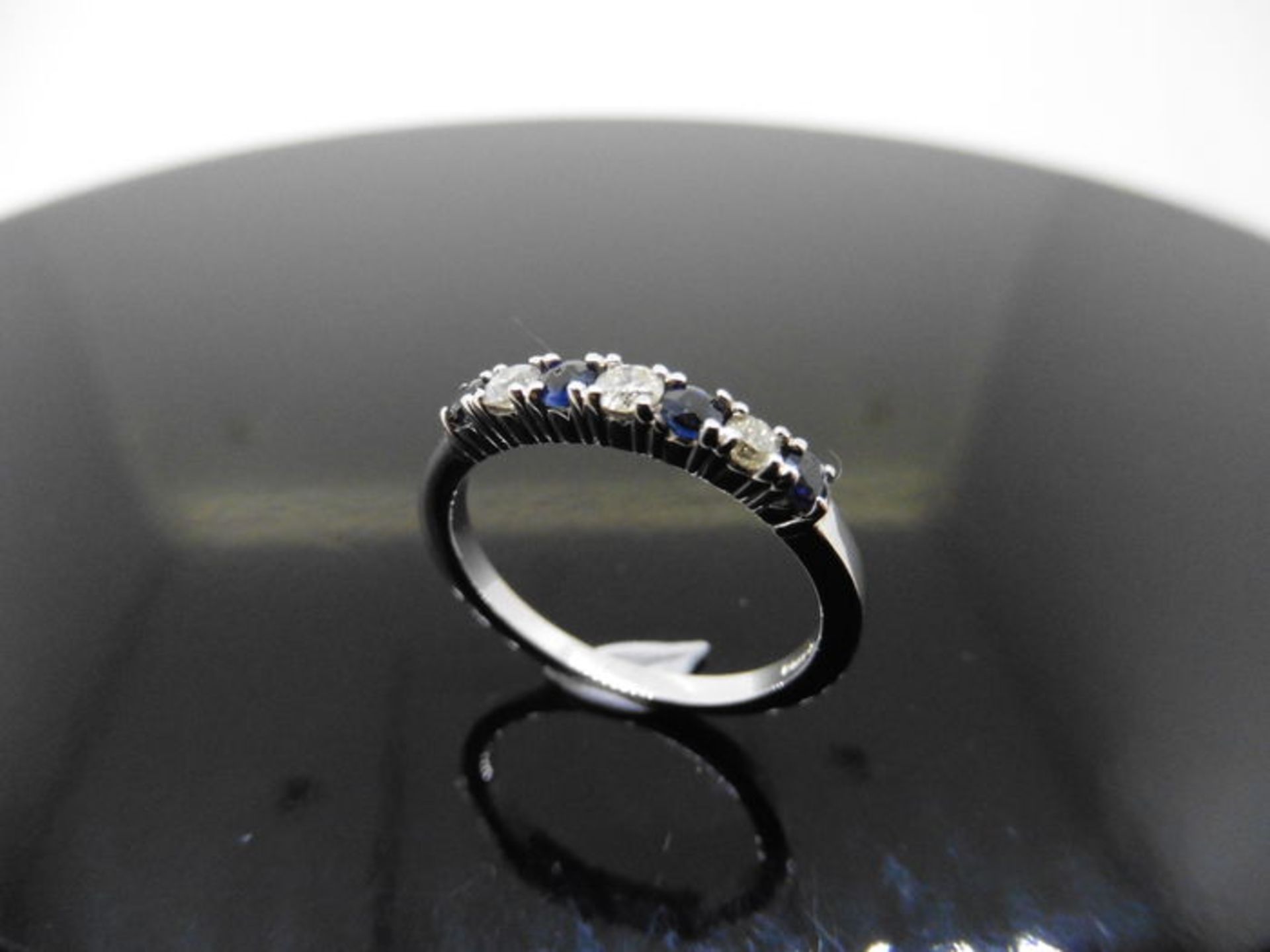 0.40ct sapphire and diamond eternity style ring. Set with 4 round cut sapphires and 3 diamonds. Size - Image 2 of 3