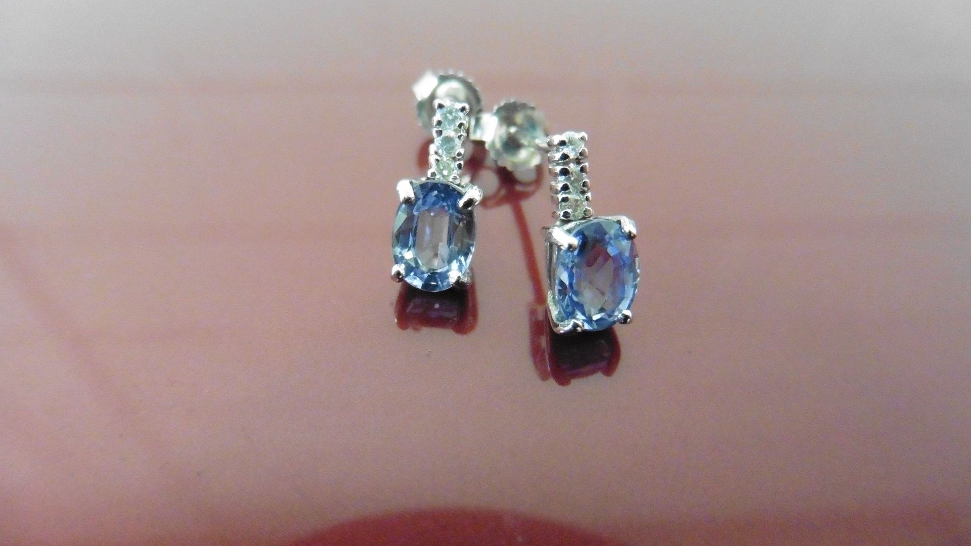 Ceylon Sapphire and diamond drop style earrings each with an Oval cut sapphire, 6 x 4mm and 4