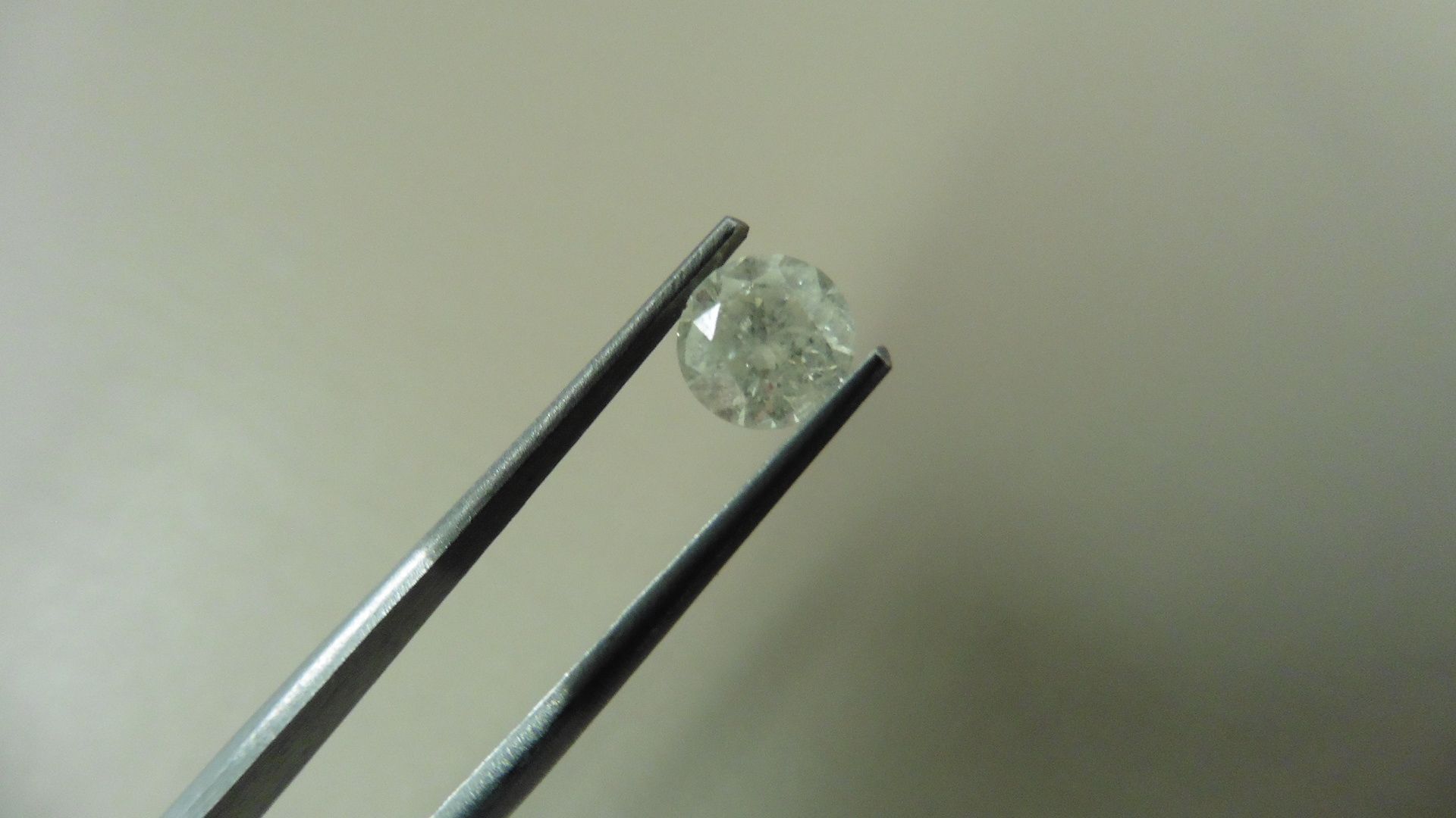 1.02ct Brilliant Cut Diamond, Enhanced stone. H colour, I1 clarity. 6.15 x 4.05mm. Valued at £