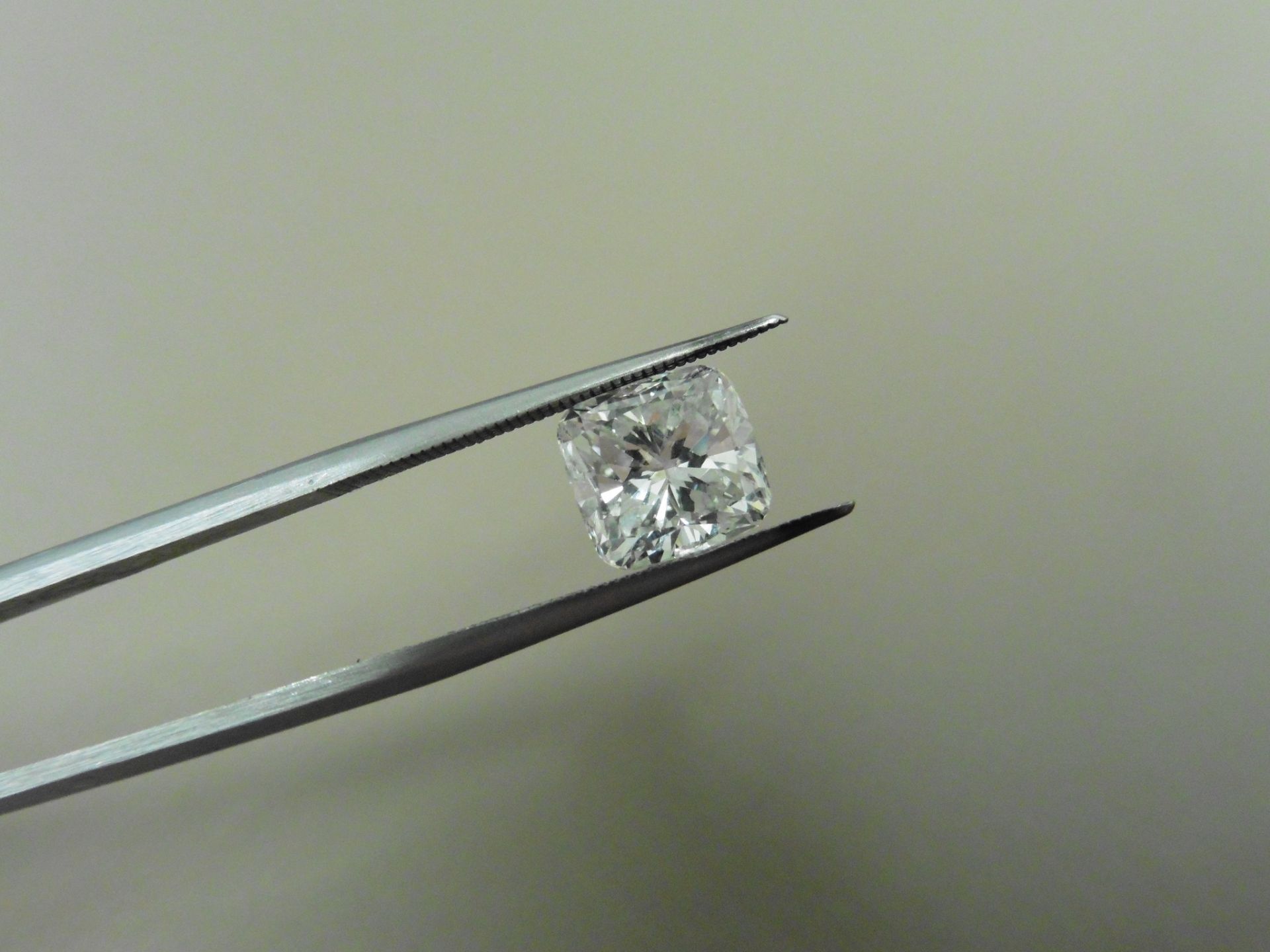 1.71ct natural cushion cut diamond. F colour and VS2 clarity. GIA certification. Valued at £33000