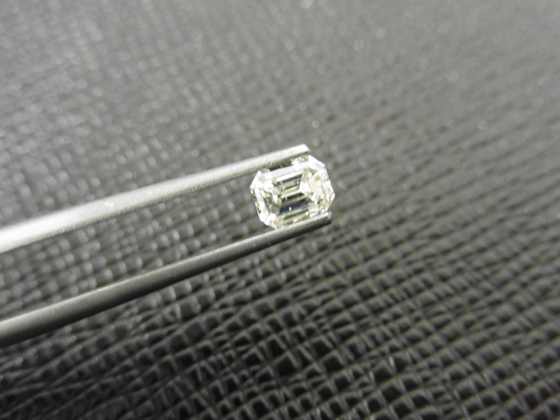 0.61ct natural emerald cut diamond. I colour and SI2 clarity. No certification but can be done