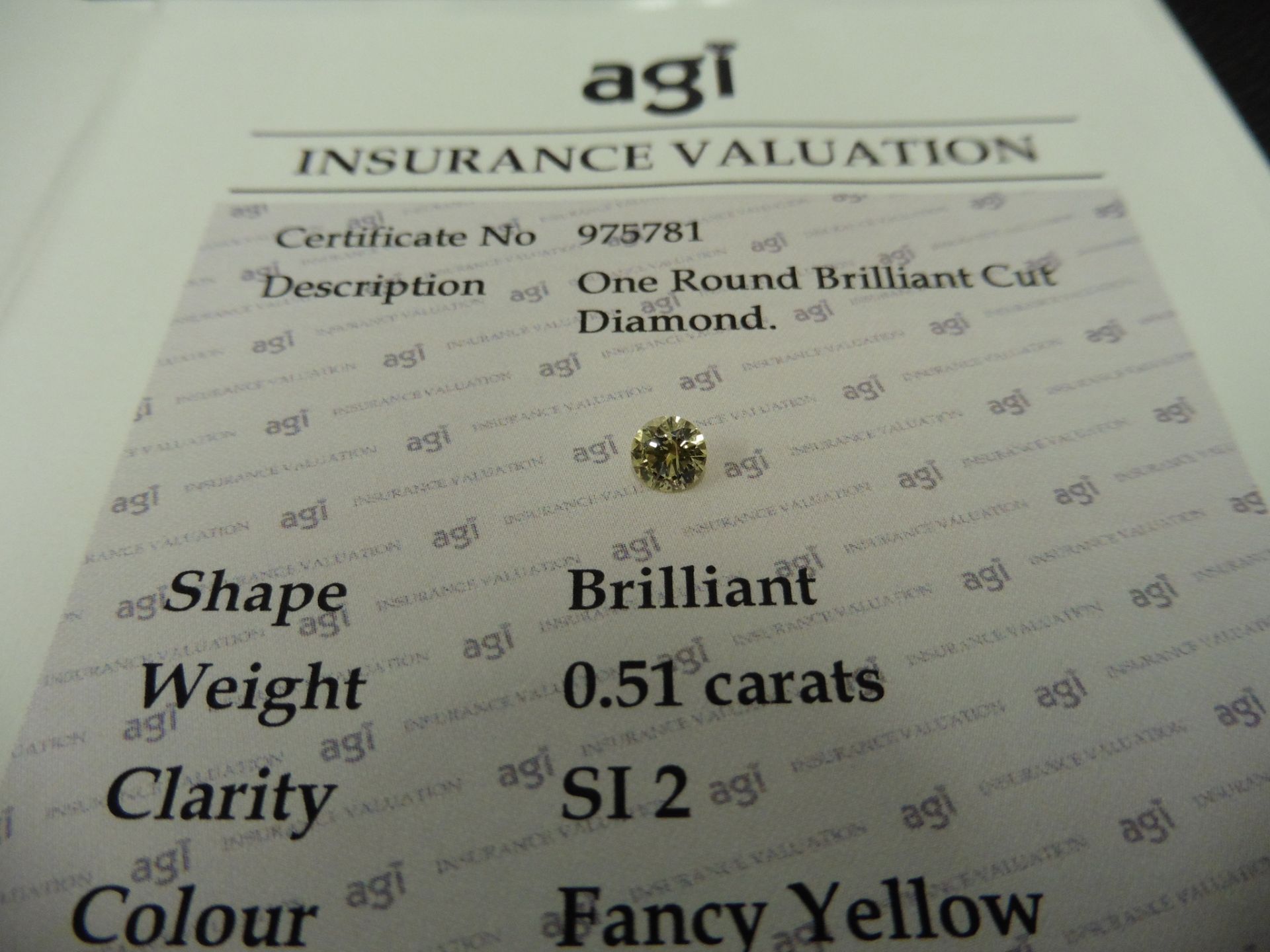 0.51ct brilliant cut diamond. Fancy yellow colour, SI2 clarity. AGI Certificate Ð 975781. Valued - Bild 3 aus 4