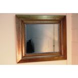 LARGE MIRROR WITH GOLD COLOURED WOODEN FRAME - 90CM X 80CM