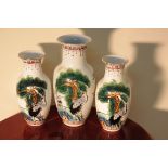 THREE ORIENTAL DECORATIVE PORCELAIN VASES DEPICTING CRANE BIRDS - CHINESE MARKINGS TO THE BASE