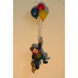 CAST RESIN CLOWN HANGING FROM BALLOONS