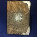 A late Victorian leather purse or wallet with sterling silver initials and corner mounts. London