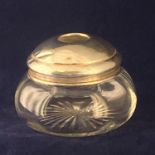 A circular silver lidded dressing table jar. Birmingham 1925 byÊHenry Perkins & Sons. Height 7cm.