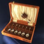 An Edwardian sterling silver set of six teaspoons and sugar nips in fitted case. Birmingham 1902.