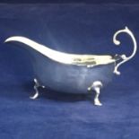 A George V sterling silver sauce boat, Chester 1924 byÊBarker Brothers. Length - 12cm, Weight - 56.