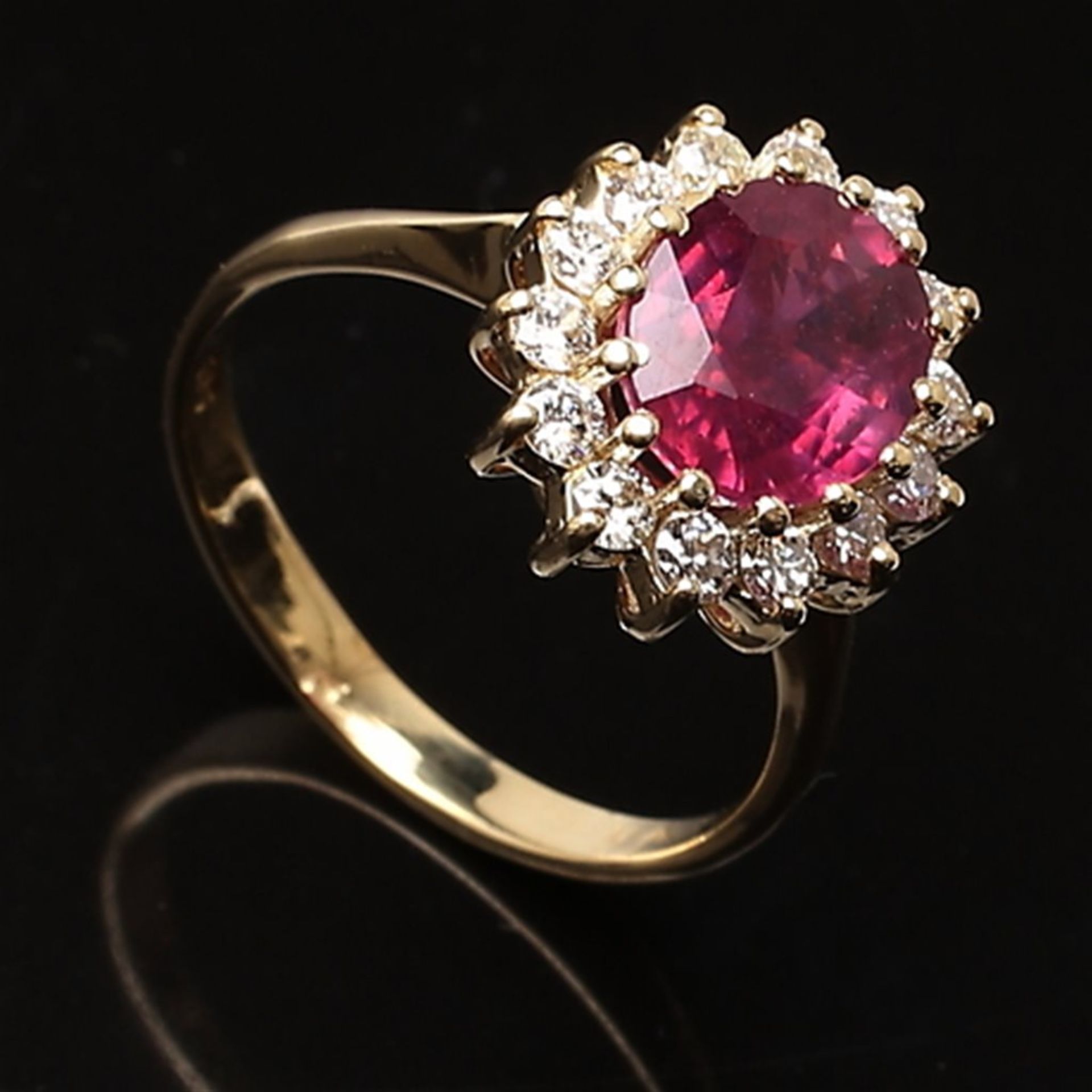 Carmo ring with oval ruby and diamonds.