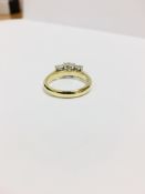 1.15ct Diamond three stone ring,070ct centre,0.30ct outer total ,4.5gms 18ct yellow/white mount .