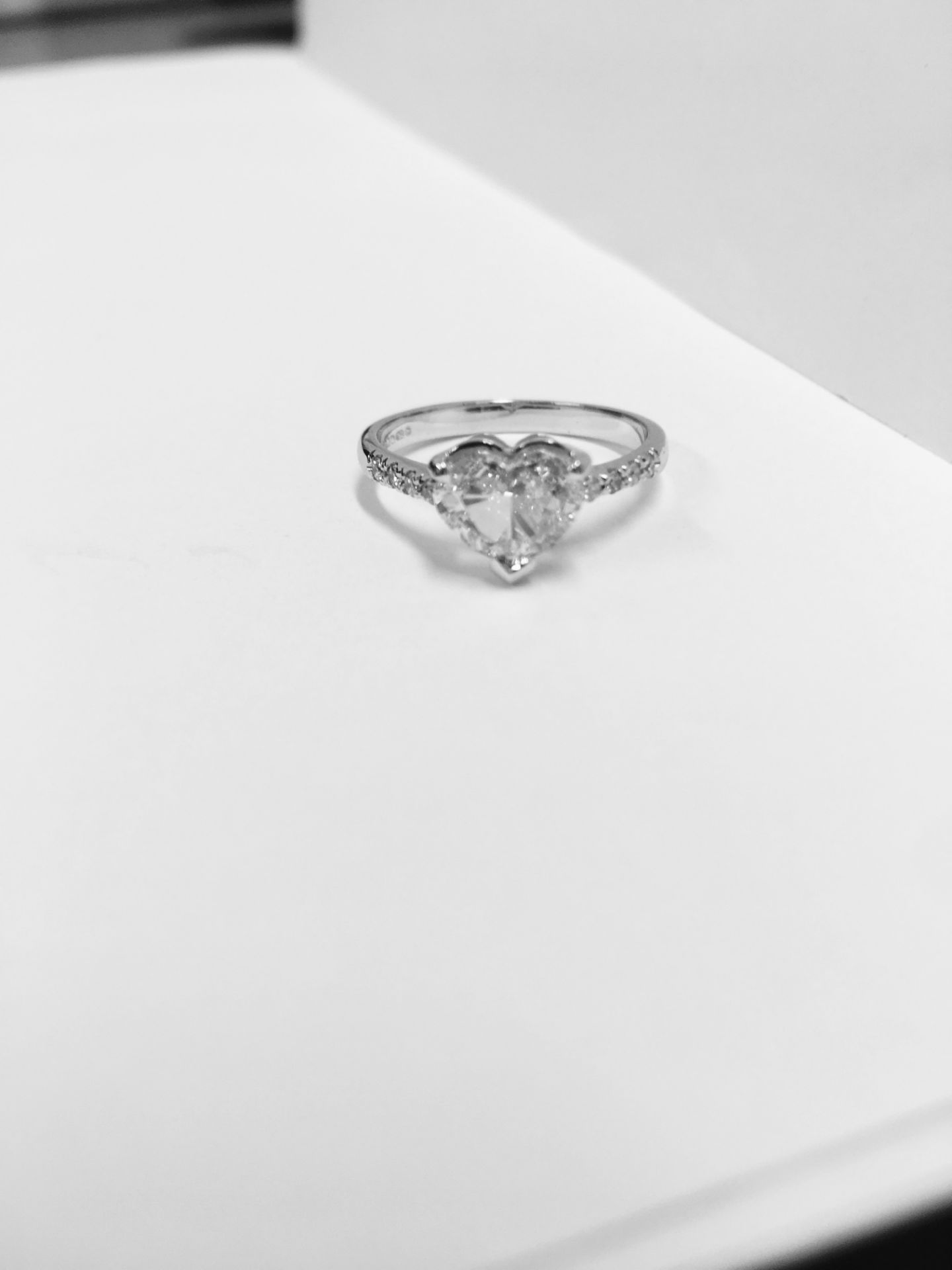 0.91ct diamond set solitaire ring set in 18ct white gold. Heart shaped diamond, I colour and Si2