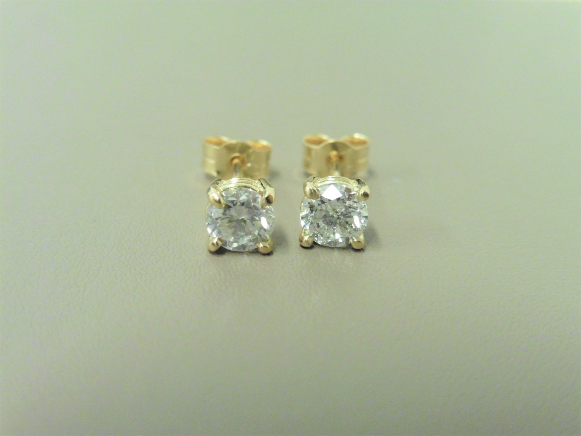 1.40ct Diamond solitaire earrings set with brilliant cut diamonds, I colour I1 clarity. Four claw