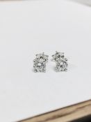 1.00ct diamond solitaire earrings set in platinum. 2 x brilliant cut diamonds, 0.50ct ( enhanced ) H