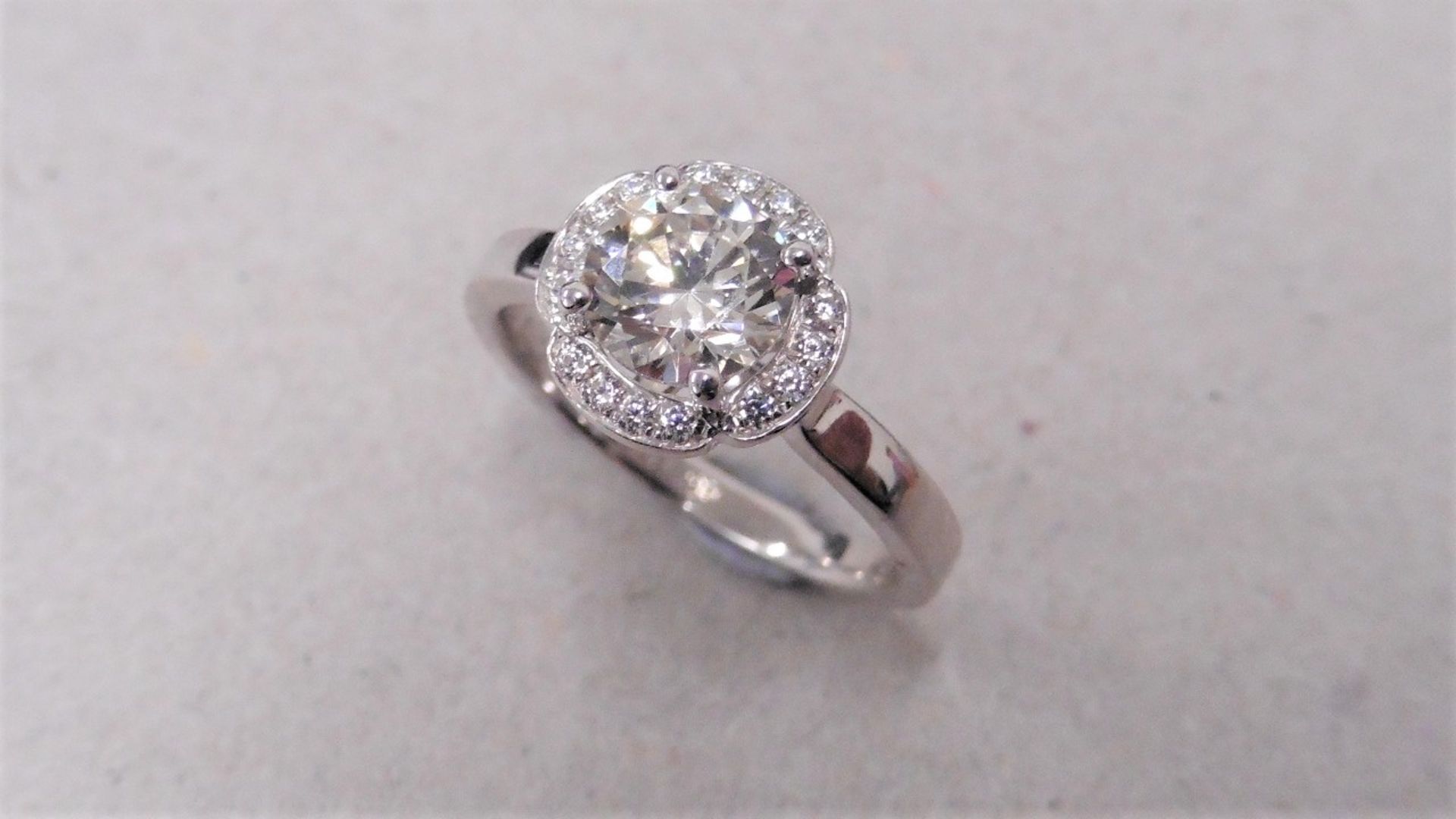 1.04ct diamond set soliatire ring in platinum. H colour and I1 clarity. Halo setting small