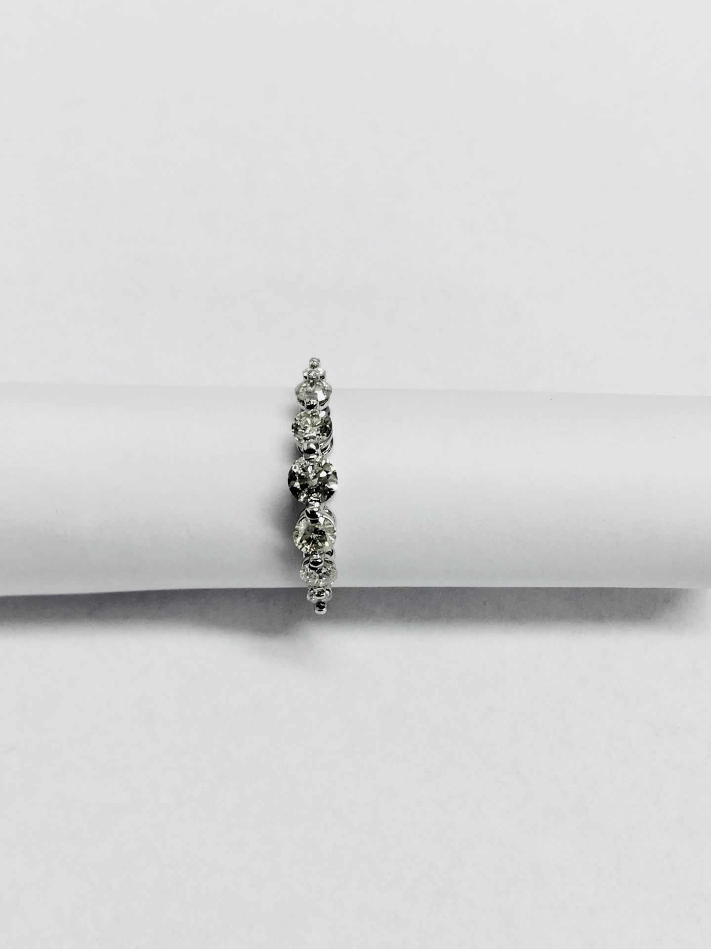 0.60ct diamond band ring set in 14ct white gold. 7 graduated brilliant cut diamonds, I colour and - Image 2 of 4