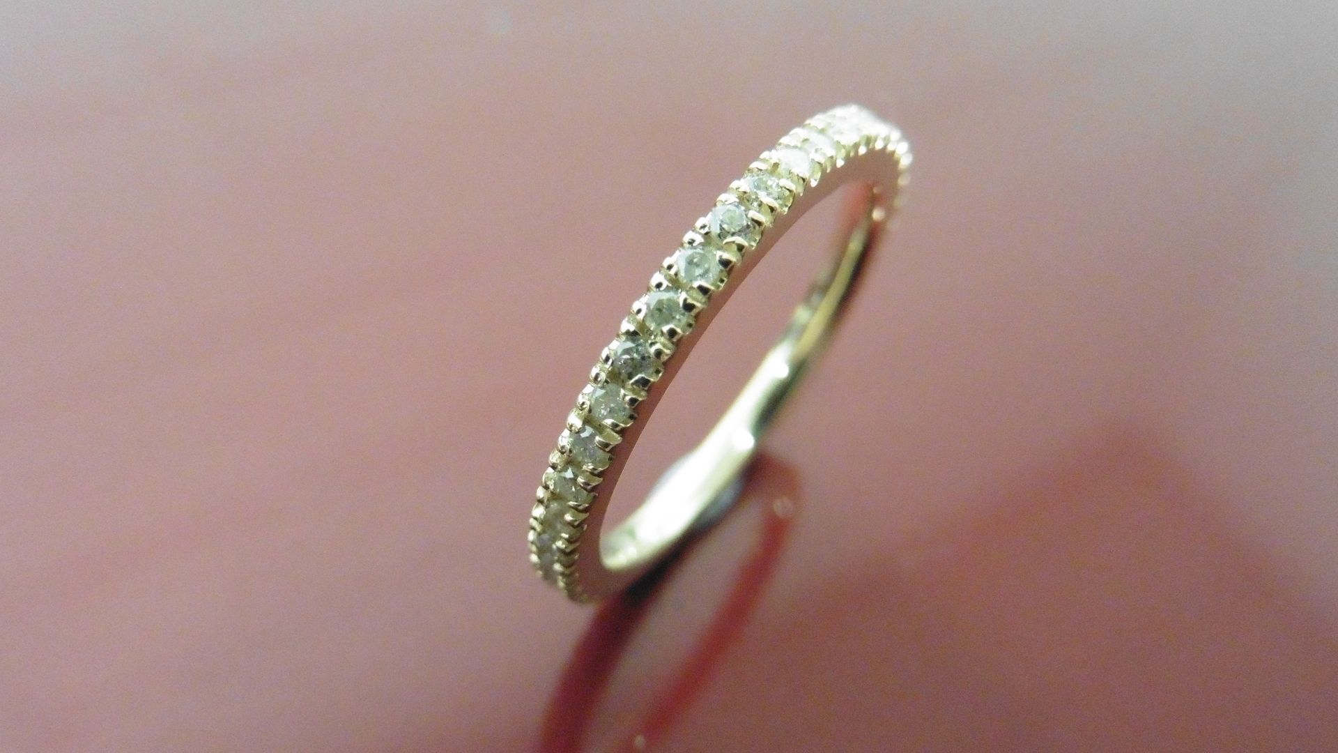 0.50ct full claw set diamond band ring set in 14ct yellow gold. Ring size M. I colour and i1