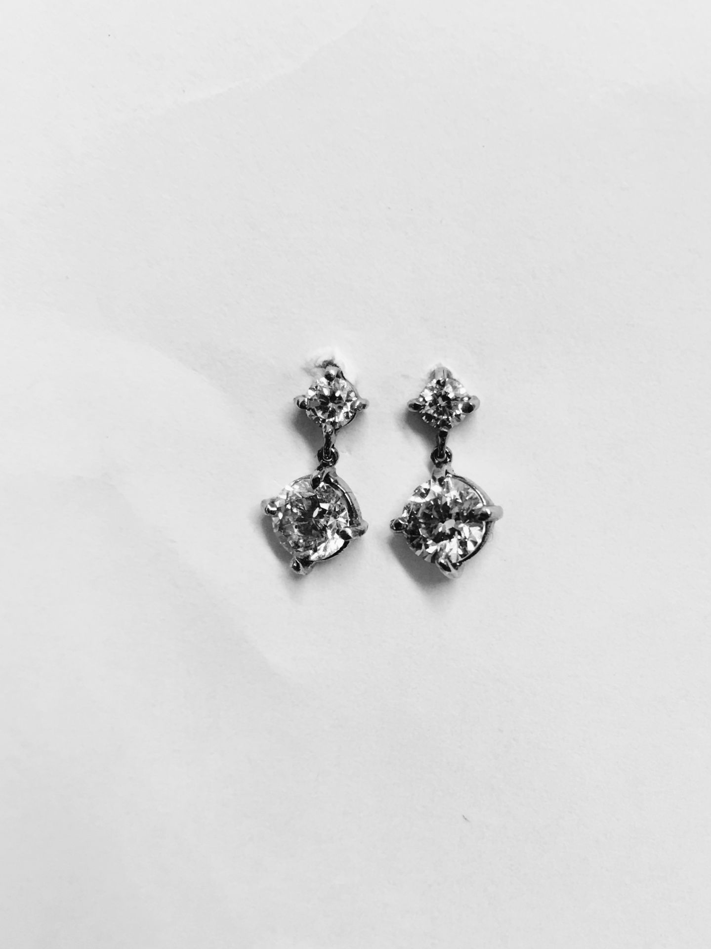 18ct white golddrop style earrings. Each has 2 brilliant cut diamonds, I colour, si3 clarity.