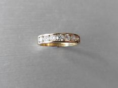 0.70ct diamond eternity band ring set in 9ct yellow gold. 7 brilliant cut diamonds, I colour, si3