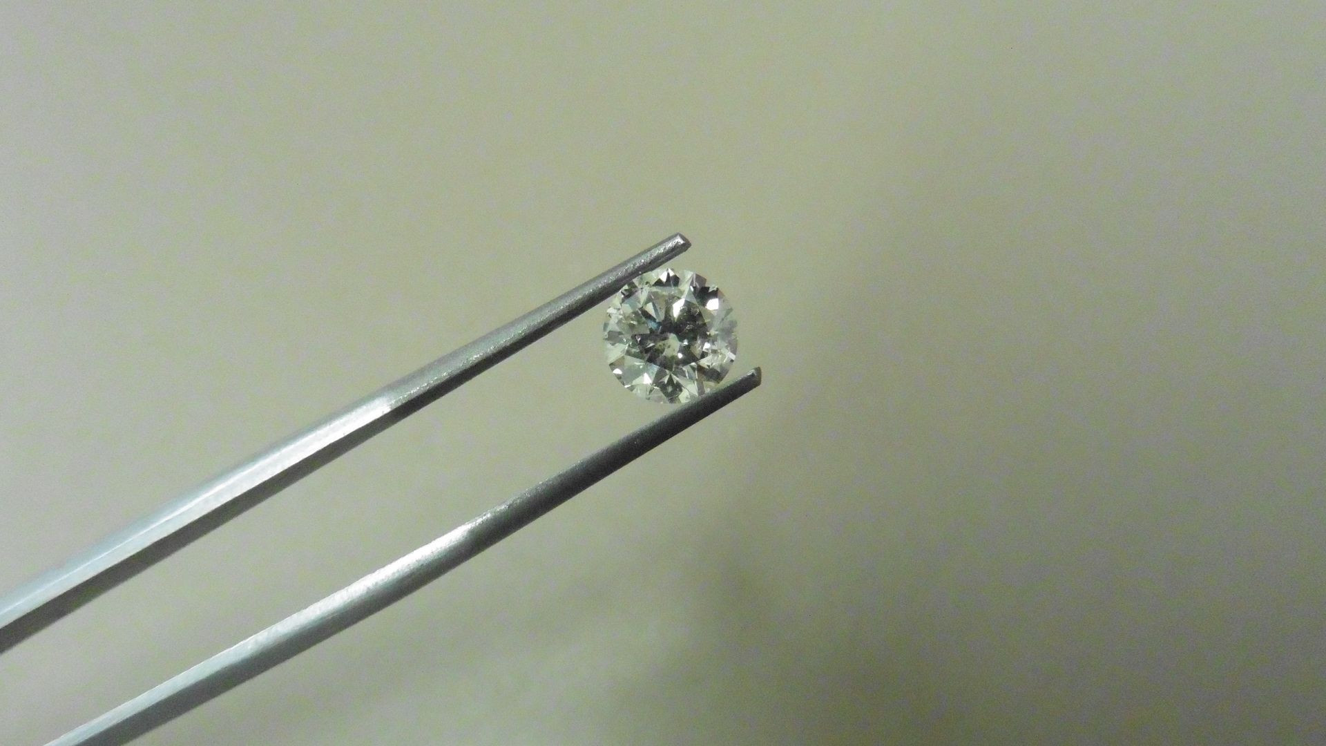 1.04ct brilliant cut diamond, loose stone.K colour and I1 clarity. 6.36 x 6.42 x 4.07mm. IGI - Image 4 of 5