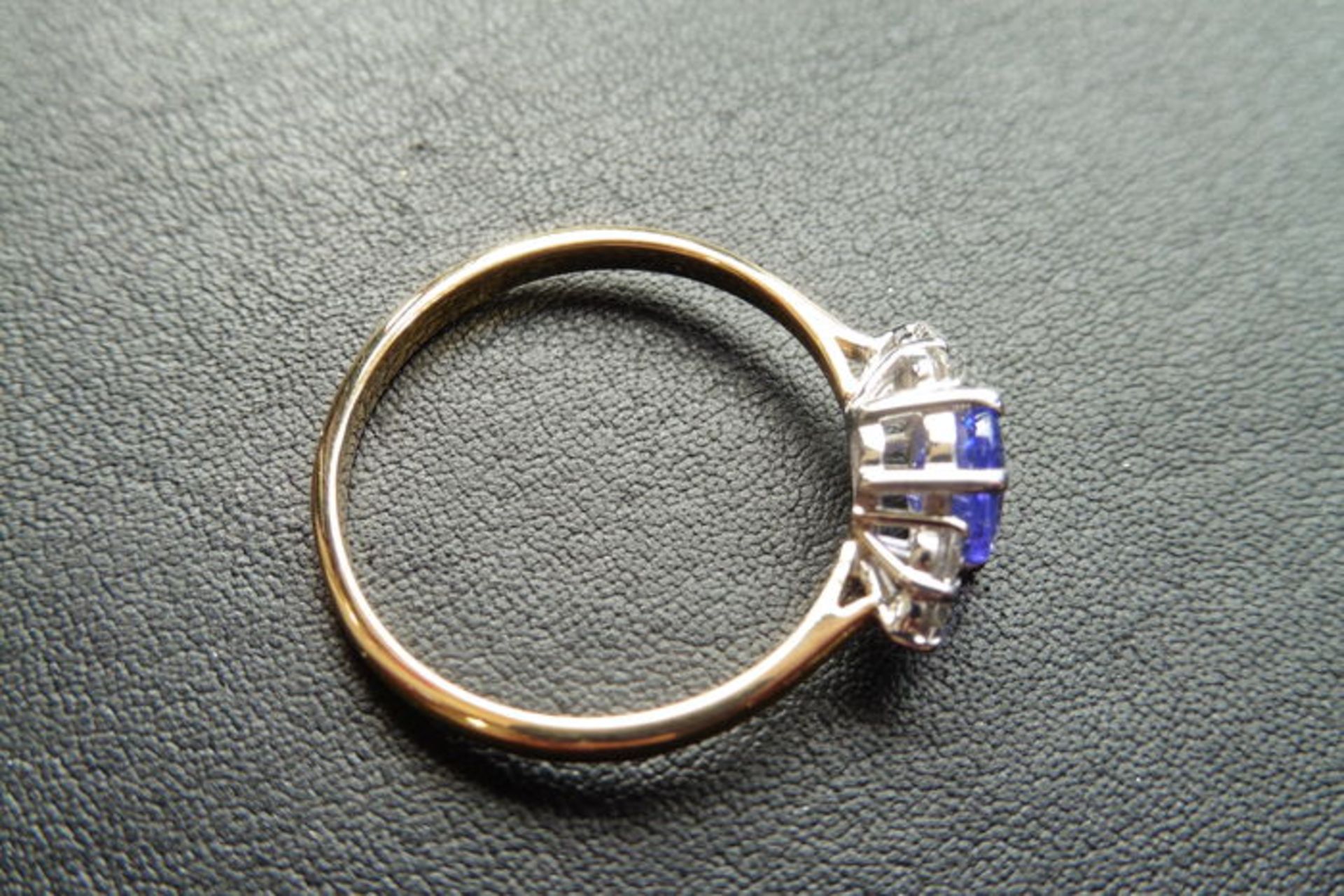 0.80t tanzanite and diamond dress ring. Oval cut ( treated ) tanzanite with 3 small brilliant cut - Image 3 of 3