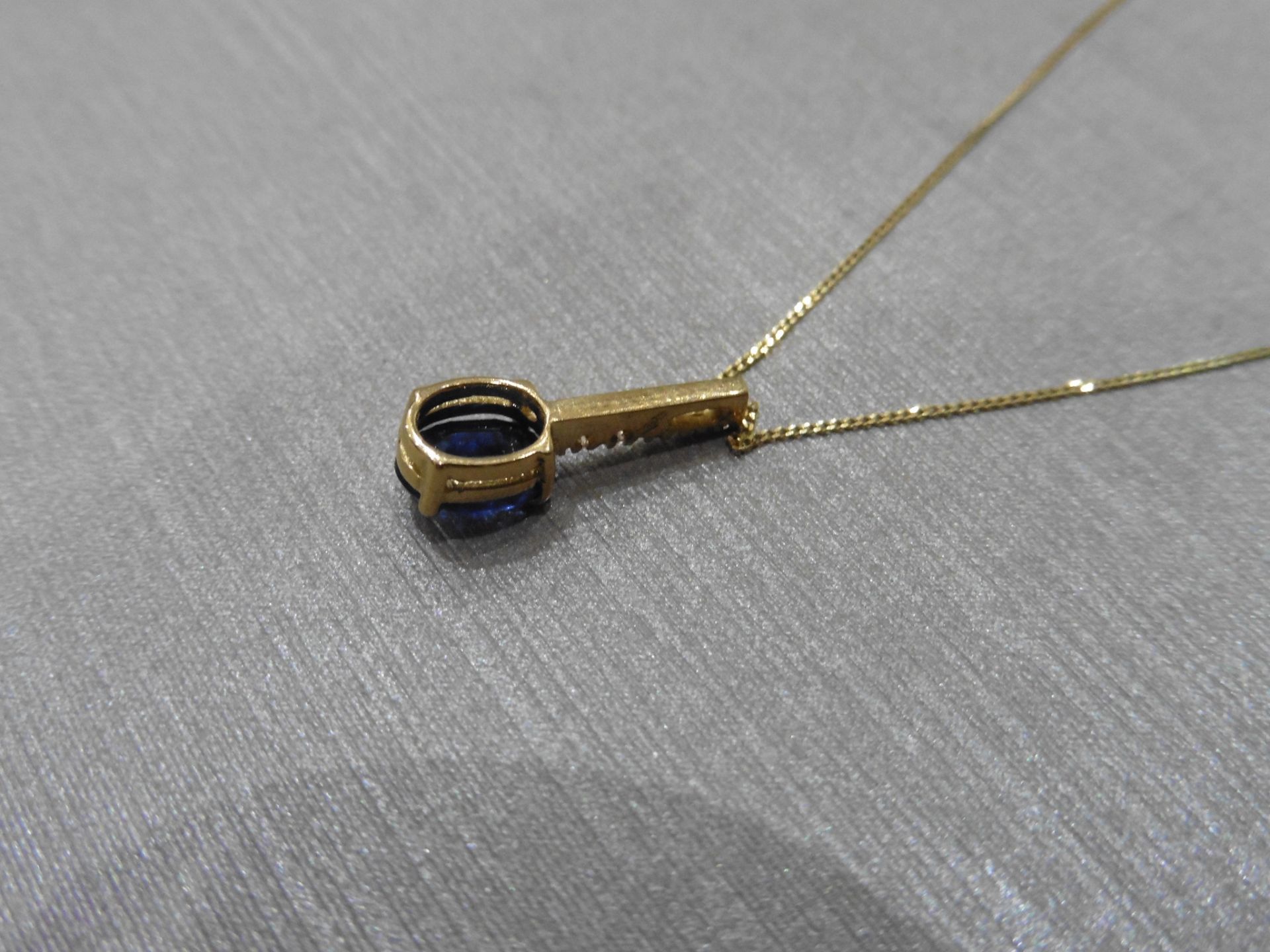 0.80ct sapphire and diamond drop style pendant. 7X 5mm oval sapphire set with 5 small brilliant - Image 3 of 3