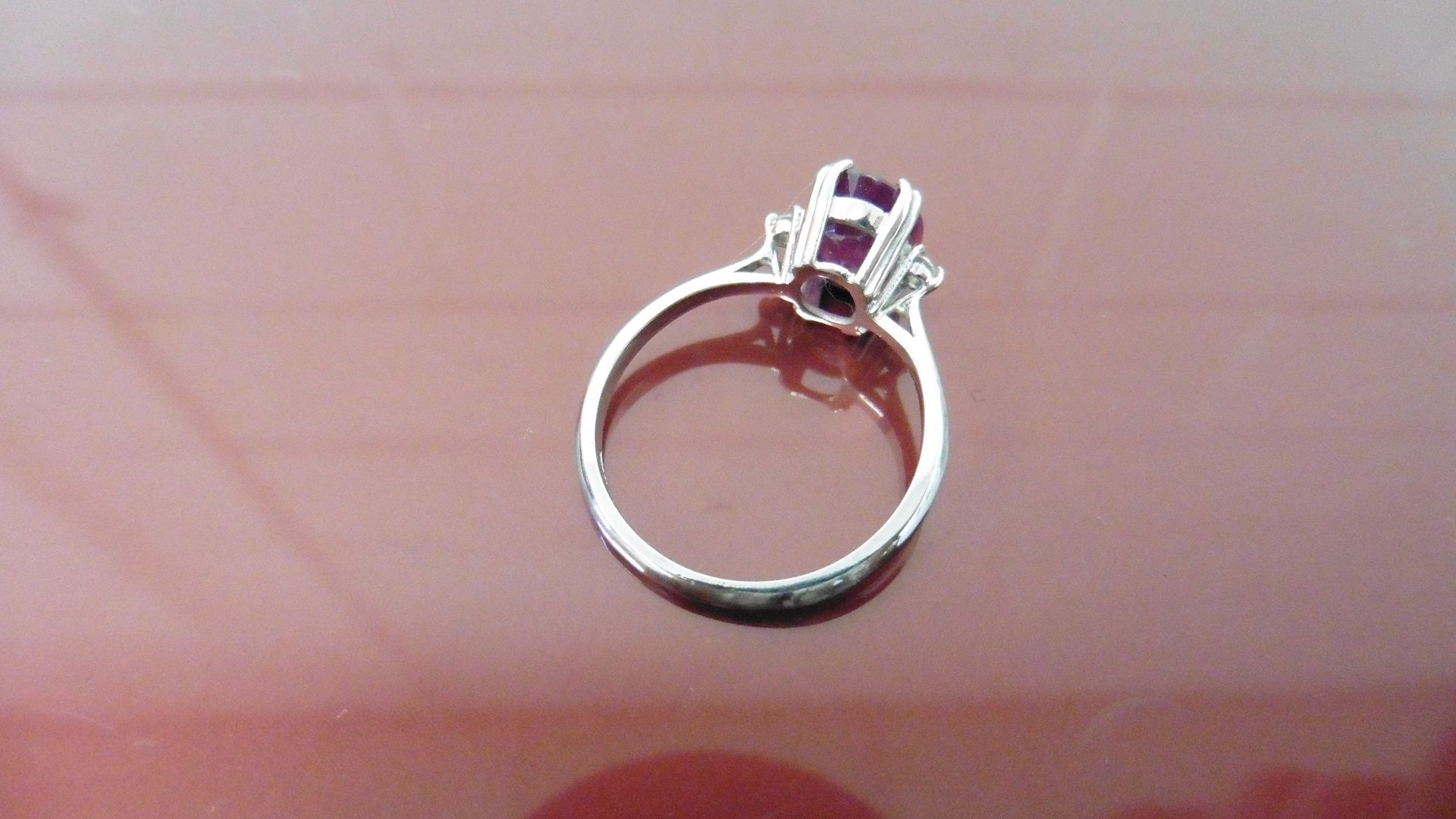 2.40ct Ruby and diamond dress ring. Oval cut ( glass filled ) ruby with a small brilliant cut - Bild 2 aus 3